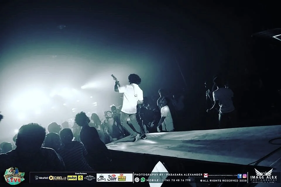Band member performing toward the live audience